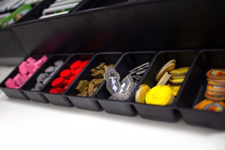 The token tray can be removed for easier reach during gameplay.